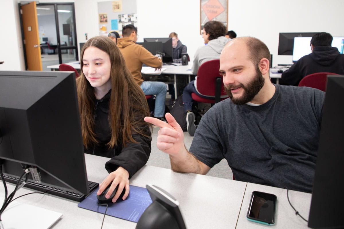 Two SJC students enrolled in the School of Business, Information Technology and Social Sciences